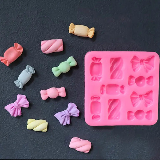 Molde para velas en forma de moñitos y dulces